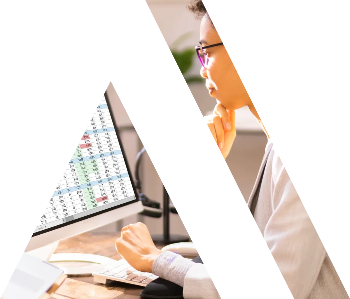 woman working on a spreadsheet at a computer masked out by the Acretis logo 'A' shape
